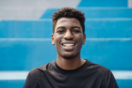 Happy young African teenager smiling in front of cameraの写真素材