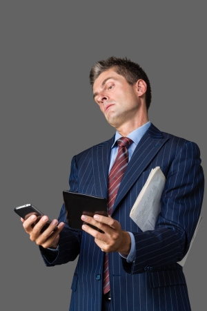 businessman thinking about having too many instancesの写真素材