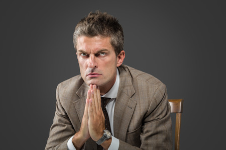 Portrait of a serious elegant man looking at camera の写真素材