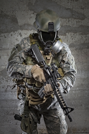 Gas mask soldier with rifleの写真素材