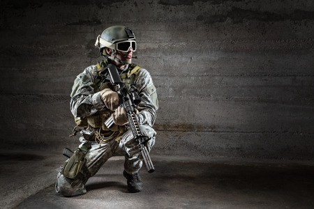 Soldier with mask rifle and backpackの写真素材