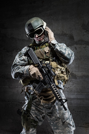 American Soldier wearing a mask and talking via radioの写真素材
