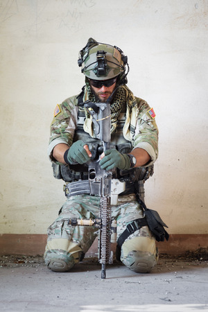 Portrait of american soldier resting from military operationの写真素材