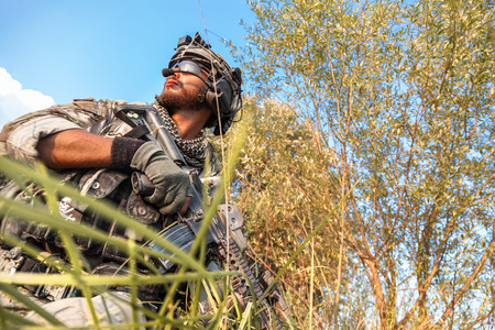 Portrait of the American Soldier in the mountains at sunsetの写真素材