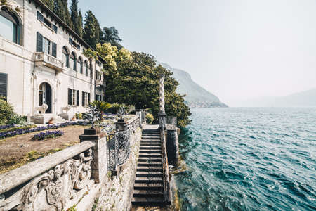A villa in a beautiful garden with trees, flowers, and plants. Como Lake. Lombardy. Italy.のeditorial素材