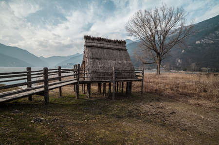 Reconstruction of a prehistoric palafitte house from neolithic ageの写真素材