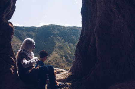 Musulman tourists looking the panorama from Vardzia cave -  Georgia - Caucasus