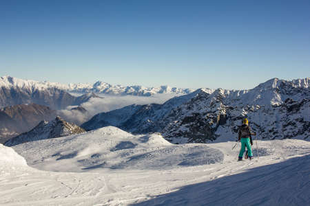 Skier enjoying panoramic view Italy Champorcher Aostaの写真素材