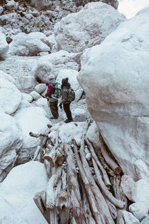 Woman and aged man hiking insdide the deepest canyon in Europe - Gola Su Gorroppu.の写真素材