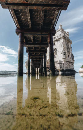 Wide angle view under the wood bridge of The Belem Tower - Old defense tower on the Tagus River - Lisbon Portugal - tourism attraction - 4の写真素材