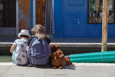 kids brother and sister with dogs in Venice - Burano - Italy