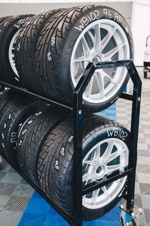 Racing car tires storage. Storage of tires in a row.の写真素材