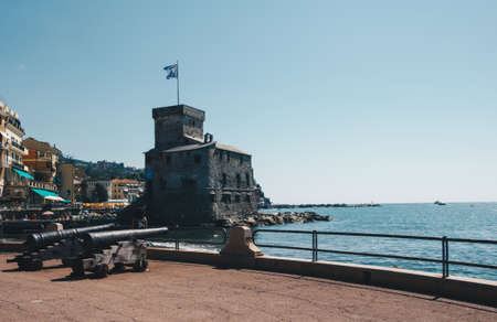 shoreline of Rapallo with castle and cannons during summer season in a sunny day - Italy.の写真素材