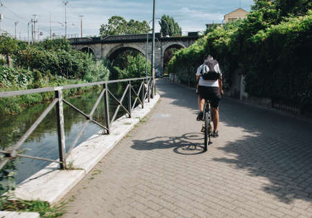 Milan ITALY - July 2018 biker along the Martesana canal in Milanのeditorial素材