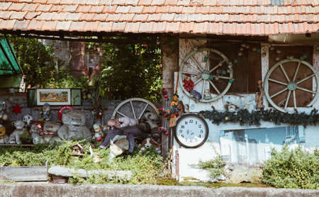 Milan ITALY - July 2018 - strange house with stuffed animal and watch in abandoned place Martesana...