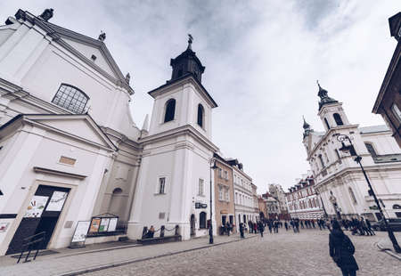 Warsaw Poland - March 2018 peoples along ways of Warsaw with church and ring bell during winter seasonのeditorial素材