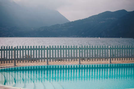 View of a swimming pool in the small village of Bellano in the shoreline of como lake - Lombardy
