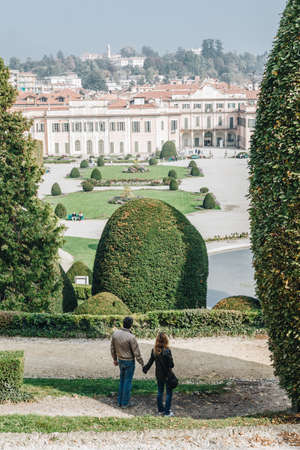 Varese OCT 2018 ITALY - Peoples hand in hand looking View of Gardens of Estense Palaceのeditorial素材