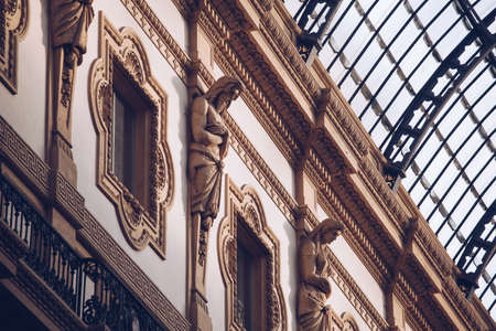 ITALY, MILAN - November 2018: closeup Interior view of Vittorio Emanuele II with statue decorationのeditorial素材