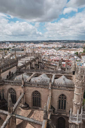 Aerial view of the Cathedral of Saint Mary of the See (Seville Cathedral) in Seville, Andalusia, Spain in a sunny and cloudy dayのeditorial素材