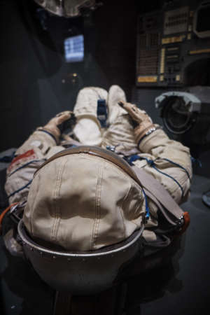 cosmonaut or astronaut or spaceman suit and helmet on board the spaceship reasy for landing or space...