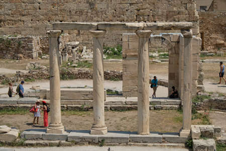 JUNE 2019 boy and girl tourists walking in the ancient area of Roman in a sunny day in the capital...
