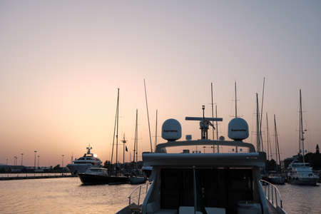 AUG 2019 Port of Cagliari at sunset with yacht and boats - Sardinia Italy