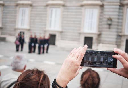 Madrid Spain - SEPT, 2019: tourist taking photo at the Guard outside the royal palaceのeditorial素材