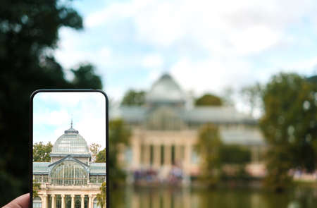 smart phone view with the crystal palace in the park of the rest in Madridのeditorial素材