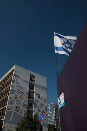 DEC 2019 tower crane - flag buildings and murals in Tel Aviv, ISRAEL