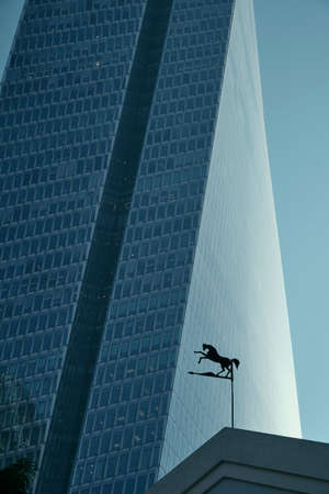 DEC 2019 tower crane - modern buildings with little horse decoration - finance center in Tel Aviv,...