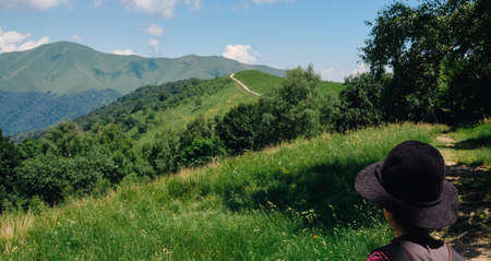 woman or girl looking the Landscape of Lake Como from an alpine trailの写真素材
