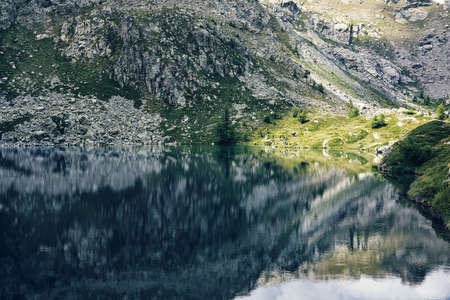 lake with mountain reflection in the water - Champorcher - Aosta - italy - peace and relax conceptの写真素材