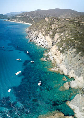 Aerial view of turquoise sea in the little bay in the city of Cagliari (Cala Barca) travel...