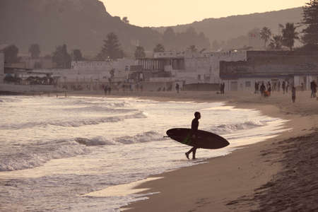 26 December 2021 ITA - boy or man practicing surf Stand up paddle sport on winter season in the...