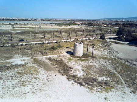 Palm trees and panoramic aerial view of the beach of Poetto in Cagliari with the Spanish towerの写真素材