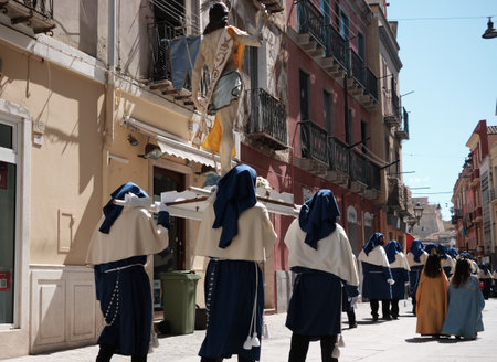 APRIL - ITALY 2022 - group of people with traditional Religion dress during Ceremony during easter - Cagliari Sardiniaのeditorial素材