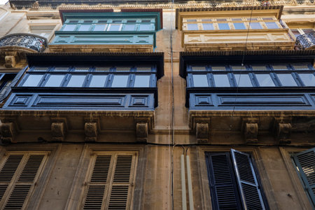 Traditional wooden balconies in a Valletta street - luxury mansions baroque style , Maltaの写真素材