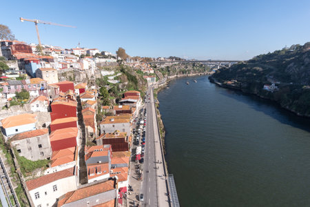 Scenic view of Porto city from a bridge overlooking the river. This picturesque landscape captures the essence of the city's beauty and vibrant atmosphere.の写真素材