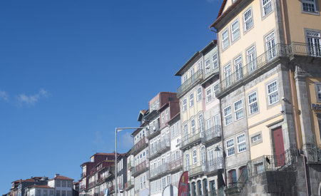 Typical colorful facades of buildings in the city of Porto, Portugal. The architecture showcases vibrant colors and unique designsの写真素材