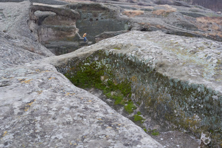 Ancient rock-cut house in Uplistsikhe, Georgia. Features Stone architecture, Archaeological site, Historic caves, and Cultural heritage.の写真素材