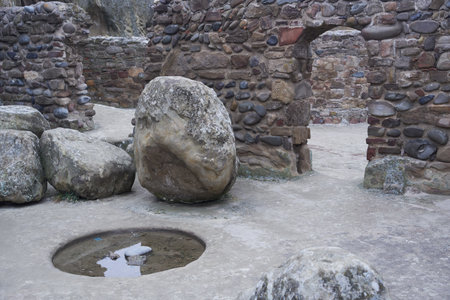 Ancient rock-cut house in Uplistsikhe, Georgia. Features Stone architecture, Archaeological site, Historic caves, and Cultural heritage.の写真素材