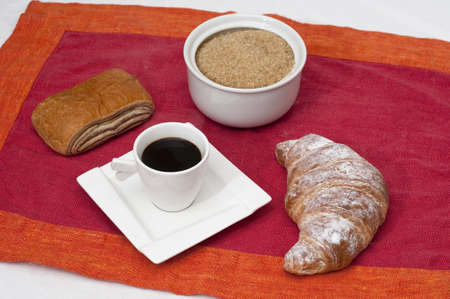 Continental breakfast with espresso coffee and a croissantの写真素材