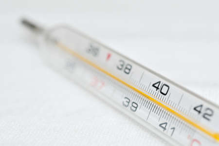 Closeup of a thermometer showing high feverの写真素材