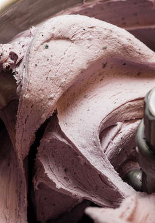 Ice cream preparation with different tools, ingredients, and machinesの写真素材