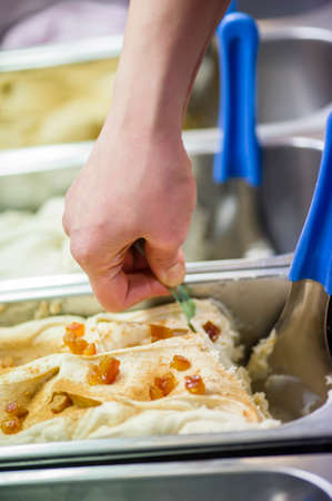 Italian ice cream on display to be scooped and soldの写真素材