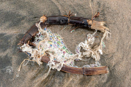 Colorful foam and bubbles induced by pollution in sea water on  beach