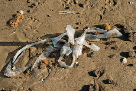 Pollution of Plastic and litter material on sand beach