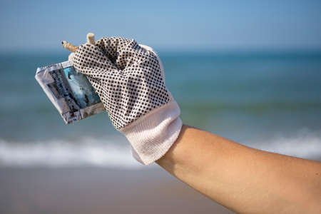 Collection of cigarette butts by volonteers on a beach