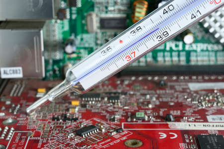 High fever temperature on computer electronic boardの写真素材